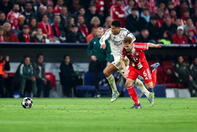 Jude Bellingham and Joshua Kimmich seen during UEFA Champions League quarterfinal game between teams of FC Bayern Munich and Real Madrid CF at Allianz Arena Germany (Grzegorz Wajda Ball Raw Images) Munich Allianz Arena Germany Copyright: xGrzegorzxWajdax grzegorzwajda_uclquarterfinalbayernreal2526__373