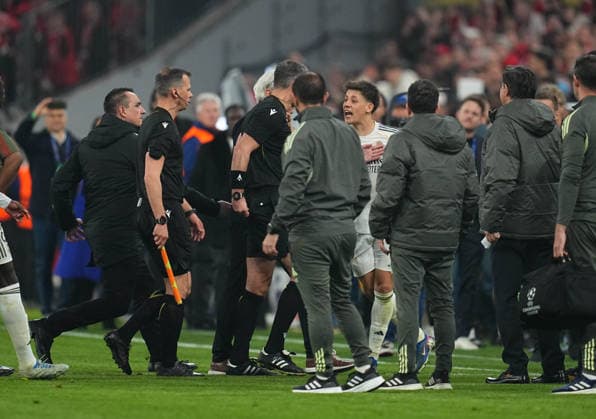 Slavko Vincic (Slovenia) and Arda Guler (Real Madrid) gestures during Bayern Munich and Real Madrid, UEFA Champions league Quarter Final UEFA Champions League, at Allianz Arena, Munich, Germany on April 15, 2026. Thor Wegner DeFodi Images. (Photo by DeFodi Images) -