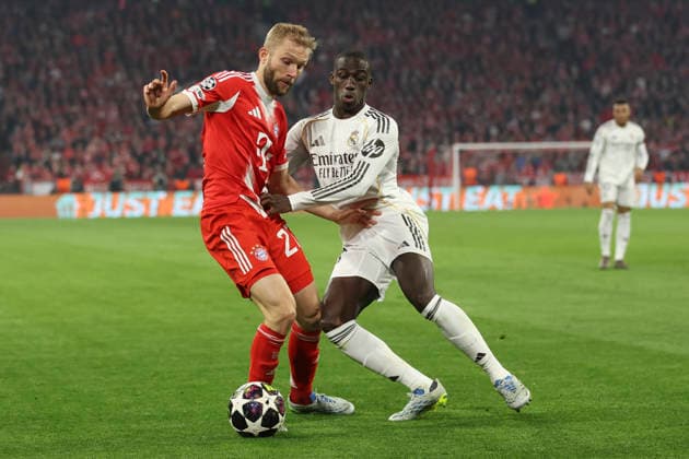 Konrad Laimer (FC Bayern München) und Ferland Mendy (Real Madrid C.F.) battle for the ball during the UEFA Champions League 2025 26 Quarter-Final Second Leg match between FC Bayern München and Real Madrid CF at Football Arena Munich on April 15, 2026 in Munich, Germany. (Photo by Oliver Kaelke DeFodi Images) -