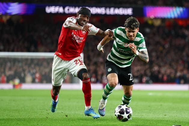 Noni Madueke of Arsenal and Maximiliano Araujo of Sporting CP battle for the ball Arsenal v Sporting, UEFA Champions League, Quarter Final, Second Leg, Football, Emirates Stadium, London, UK - 15 Apr 2026London Emirates Stadium United Kingdom EDITORIAL USE ONLY No use with unauthorised audio, video, data, fixture lists, club league logos or live services. Online in-match use limited to 120 images, no video emulation. No use in betting, games or single club league player publications. Copyright: xSimonxDael Shutterstockx 16828544dd