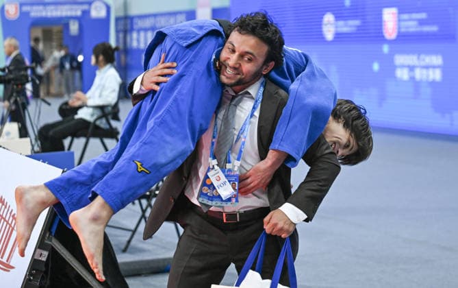(260416) -- ORDOS, April 16, 2026 -- Ruslan Poltoratskii (R) of Bahrain celebrates with his coach after the men s -60kg final against Yang Yung Wei of Chinese Taipei at the Asian Judo Championships 2026 in Ordos, north China s Inner Mongolia Autonomous Region, April 16, 2026. ) (SP)CHINA-ORDOS-JUDO-ASIAN CHAMPIONSHIPS 2026-MEN S 60KG-FINAL BeixHe 