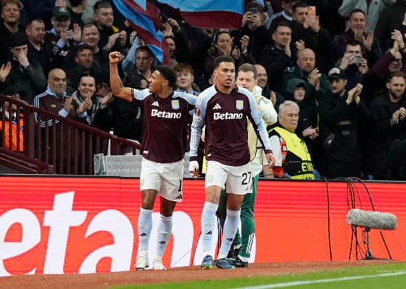 Birmingham, England, 16th April 2026. Morgan Rogers of Aston Villa (l) celebrates scoring their third goal during the Aston Villa vs Bologna UEFA Europa League quarter final 2nd leg match at Villa Park, Birmingham. Picture credit should read: Andrew Yates Sportimage EDITORIAL USE ONLY. No use with unauthorised audio, video, data, fixture lists, club league logos or live services. Online in-match use limited to 120 images, no video emulation. No use in betting, games or single club league player publications. SPI_046_AY_Villa_Bologna SPI-4689-0046