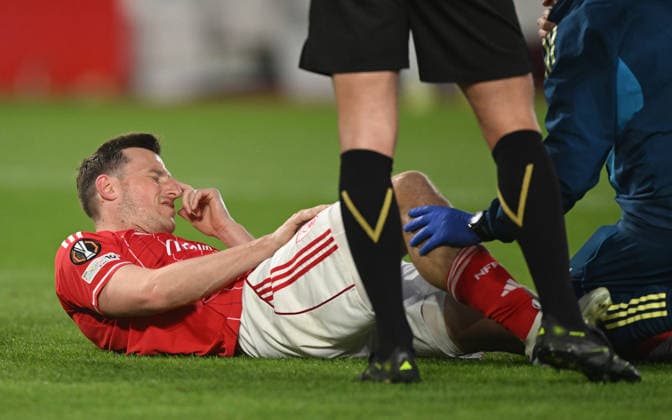 Nottingham, England, 16th April 2026. Chris Wood of Nottingham Forest injured during the Nottingham Forest vs FC Porto UEFA Europa League quarter final 2nd leg match at the City Ground, Nottingham. Picture credit should read: Harriet Massey Sportimage EDITORIAL USE ONLY. No use with unauthorised audio, video, data, fixture lists, club league logos or live services. Online in-match use limited to 120 images, no video emulation. No use in betting, games or single club league player publications. SPI_040_FOREST_V_PORTOx SPI-4690-0044
