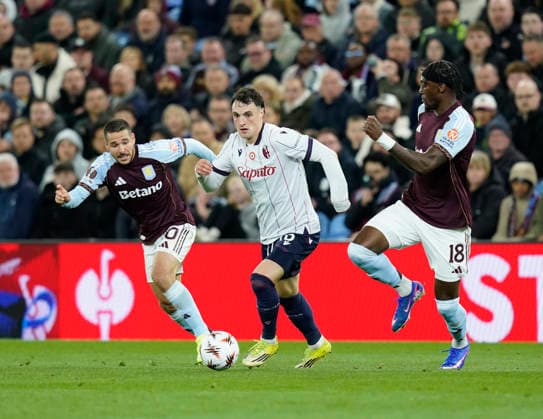 Birmingham, England, 16th April 2026. Emiliano Buendia of Aston Villa (l) Bologna s Bodin Tomasevic (c) and Tammy Abrahams of Aston Villa (r) during the Aston Villa vs Bologna UEFA Europa League quarter final 2nd leg match at Villa Park, Birmingham. Picture credit should read: Andrew Yates Sportimage EDITORIAL USE ONLY. No use with unauthorised audio, video, data, fixture lists, club league logos or live services. Online in-match use limited to 120 images, no video emulation. No use in betting, games or single club league player publications. SPI_051_AY_Villa_Bologna SPI-4689-0051