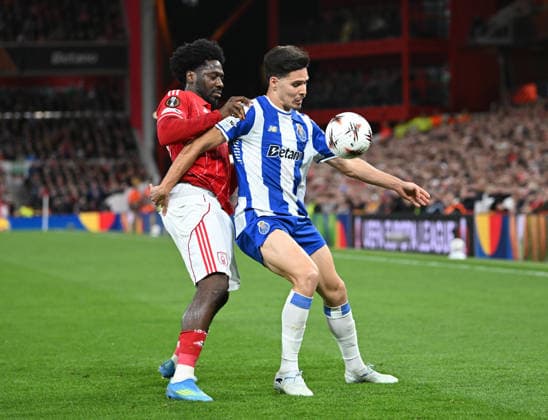 Nottingham, England, 16th April 2026. Ola Aina of Nottingham Forest (l) holds up Francisco Moura of FC Porto (r) during the Nottingham Forest vs FC Porto UEFA Europa League quarter final 2nd leg match at the City Ground, Nottingham. Picture credit should read: Harriet Massey Sportimage EDITORIAL USE ONLY. No use with unauthorised audio, video, data, fixture lists, club league logos or live services. Online in-match use limited to 120 images, no video emulation. No use in betting, games or single club league player publications. SPI_044_FOREST_V_PORTO SPI-4690-0048