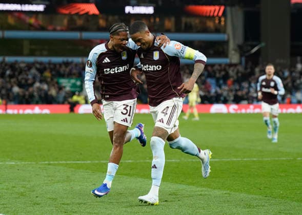 Birmingham, England, 16th April 2026. Ezri Konsa of Aston Villa (r) celebrates scoring their fourth goal during the Aston Villa vs Bologna UEFA Europa League quarter final 2nd leg match at Villa Park, Birmingham. Picture credit should read: Andrew Yates Sportimage EDITORIAL USE ONLY. No use with unauthorised audio, video, data, fixture lists, club league logos or live services. Online in-match use limited to 120 images, no video emulation. No use in betting, games or single club league player publications. SPI_062_AY_Villa_Bologna SPI-4689-0064
