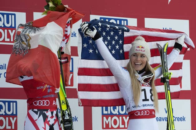 Feb. 3, 2015 - Beaver Creek, Colorado, U.S - LINDSEY VONN of the United States (right), laughs as she watches ANNA FENNINGER of Austria (left), wrap the Austrian flag around herself during the podium ceremony for the Ladies Super G during the FIS Alpine World Ski Championships. VONN finished in third place, while FENNINGER finished in first place. Copyright: xJasonxConnollyx