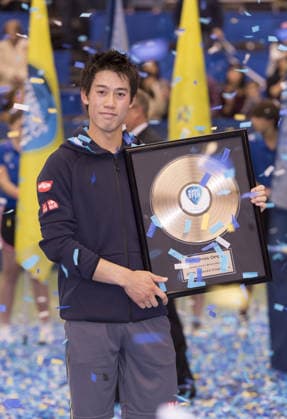 Feb. 15, 2015 - Memphis, TN, USA - Memphis, TN - February 15: Kei Nishikori(JPN) poses with the Champions trophy after defeating Kevin Anderson(RSA) 64 64 at the 2015 Memphis Open in Memphis, Tennesse. Photographer Andrew Patron. Copyright: xAndrewxPatronx