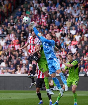 Brentford v Fulham, Premier League, Football, Gtech Community Stadium, Brentford, London, UK - 18 Apr 2026 Goalkeeper Bernd Leno of Fulham punches the ball away from a challenge from Mikkel Damsgaard of Brentford London Gtech Community Stadium Brentford UK, UK NEWSPAPERS OUT Copyright: xSeanxRyanx