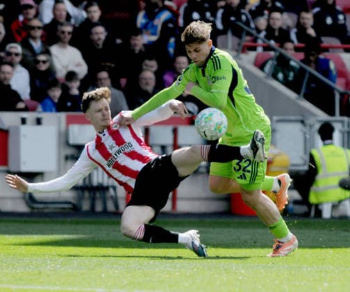 Football - 2025 2026 Premier League - Brentford vs. Fulham - Gtech Community Stadium - Saturday 18th April 2026 Keane Lewis Potter of Brentford tussles with Emile Smith Rowe of Fulham 