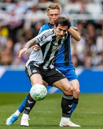 18th April 2026; St James Park, Newcastle, England; Premier League Football, Newcastle United versus Bournemouth; Adrien Truffert of Bournemouth held off by Sandro Tonali of Newcastle United WMxSportsxMedia