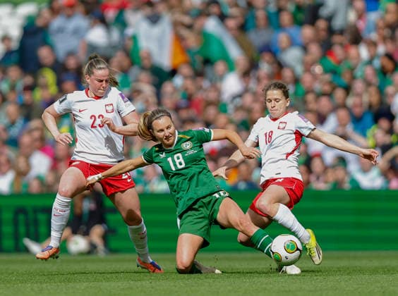 18th April 2026; Aviva Stadium, Dublin, Ireland; 2026 Womens World Cup Qualifier Football, Republic of Ireland versus Poland; Kyra Carusa of Ireland tackles the ball away from Nadia Krezyman of Poland PeterxFitzpatrick