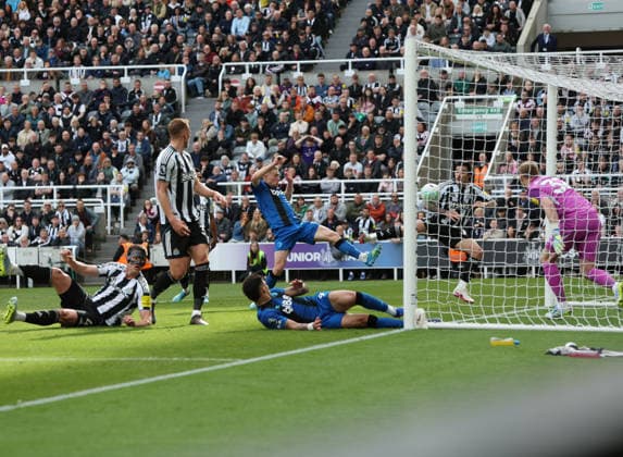 Newcastle Upon Tyne, England, 18th April 2026. Adrien Truffert of AFC Bournemouth scores his teams second goal during the Newcastle United vs AFC Bournemouth Premier League match at St. James Park, Newcastle Upon Tyne. Picture credit should read: Nigel Roddis Sportimage EDITORIAL USE ONLY. No use with unauthorised audio, video, data, fixture lists, club league logos or live services. Online in-match use limited to 120 images, no video emulation. No use in betting, games or single club league player publications. SPI_038_NR_NEWC_BOUR SPI-4699-0037