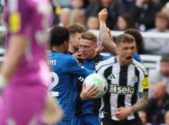 Newcastle Upon Tyne, England, 18th April 2026. Adrien Truffert of AFC Bournemouth celebrates scoring his teams second goal during the Newcastle United vs AFC Bournemouth Premier League match at St. James Park, Newcastle Upon Tyne. Picture credit should read: Nigel Roddis Sportimage EDITORIAL USE ONLY. No use with unauthorised audio, video, data, fixture lists, club league logos or live services. Online in-match use limited to 120 images, no video emulation. No use in betting, games or single club league player publications. SPI_051_NR_NEWC_BOUR SPI-4699-0049