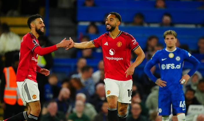 Matheus Cunha of Manchester United, ManU celebrates scoring the opening goal with Noussair Mazraoui Chelsea v Manchester United, Premier League, Football, Stamford Bridge, London, UK - 18 Apr 2026London Stamford Bridge United Kingdom EDITORIAL USE ONLY No use with unauthorised audio, video, data, fixture lists, club league logos or live services. Online in-match use limited to 120 images, no video emulation. No use in betting, games or single club league player publications. Copyright: xJavierxGarcia Shutterstockx 16832178ai