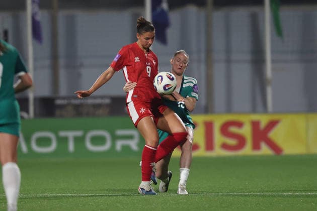Kailey Willis (left) of Malta is challenged by Rebecca Holloway of Northern Ireland during the FIFA Women™s World Cup 2027 European qualifiers League B, Group B2 soccer match between Malta and Nothern Ireland at the Centenary Stadium, Ta™ Qali, Malta on 18 April 2026. Women™s European Qualifiers - Malta v Northern Ireland