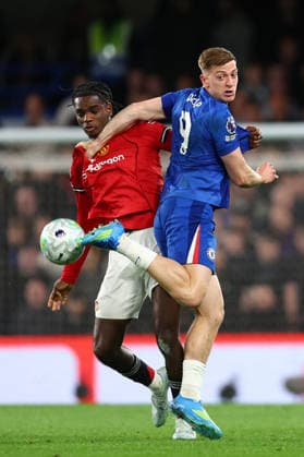 London, England, 18th April 2026. Ayden Heaven of Manchester United, ManU and Liam Delap of Chelsea challenge for the ball during the Chelsea vs Manchester United Premier League match at Stamford Bridge, London. Picture credit should read: Paul Terry Sportimage EDITORIAL USE ONLY. No use with unauthorised audio, video, data, fixture lists, club league logos or live services. Online in-match use limited to 120 images, no video emulation. No use in betting, games or single club league player publications. SPI_035_PT_Chelsea_Man_Utd SPI-4701-0035