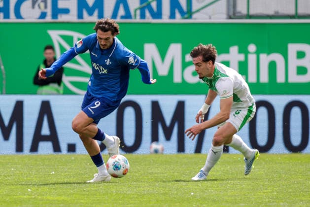 19.04.2026, xgrfx, Fussball 2.Bundesliga, SpVgg Greuther Fuerth - SV Darmstadt 98 v.l. Fraser Hornby (SV Darmstadt), Reno Münz (Greuther Fürth) (DFL DFB REGULATIONS PROHIBIT ANY USE OF PHOTOGRAPHS as IMAGE SEQUENCES and or QUASI-VIDEO) Fuerth