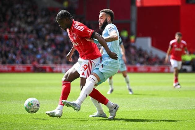 Nottingham, England, 19th April 2026. Quilindschy Hartman of Burnley makes a tackle against Dilane Bakwa of Nottingham Forest during the Nottingham Forest vs Burnley Premier League match at the City Ground, Nottingham. Picture credit should read: Harriet Massey Sportimage EDITORIAL USE ONLY. No use with unauthorised audio, video, data, fixture lists, club league logos or live services. Online in-match use limited to 120 images, no video emulation. No use in betting, games or single club league player publications. SPI_048_FOREST_V_BURNLEY SPI-4702-0045
