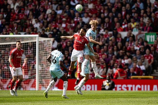 19th April 2026; The City Ground, Nottingham, England; Premier League Football, Nottingham Forest versus Burnley; Zian Flemming of Burnley and Morgan Gibbs-White of Nottingham Forest compete for the ball in the air GodfreyxPitt
