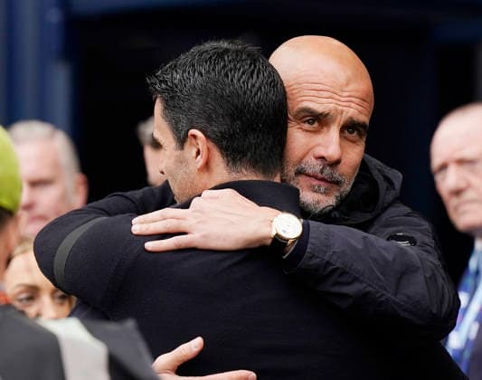 Manchester, England, 19th April 2026. Pep Guardiola coach of Manchester City (r) welcomes Mikel Arteta manager of Arsenal during the Manchester City vs Arsenal Premier League match at the Etihad Stadium, Manchester. Picture credit should read: Andrew Yates Sportimage EDITORIAL USE ONLY. No use with unauthorised audio, video, data, fixture lists, club league logos or live services. Online in-match use limited to 120 images, no video emulation. No use in betting, games or single club league player publications. SPI_029_AY_Man_City_Arsenal SPI-4704-0029
