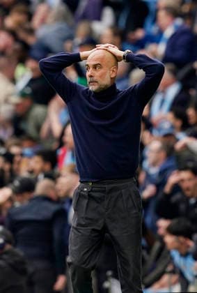 Manchester, England, 19th April 2026. Pep Guardiola coach of Manchester City reacts to a chance during the Manchester City vs Arsenal Premier League match at the Etihad Stadium, Manchester. Picture credit should read: Andrew Yates Sportimage EDITORIAL USE ONLY. No use with unauthorised audio, video, data, fixture lists, club league logos or live services. Online in-match use limited to 120 images, no video emulation. No use in betting, games or single club league player publications. SPI_036_AY_Man_City_Arsenal SPI-4704-0036