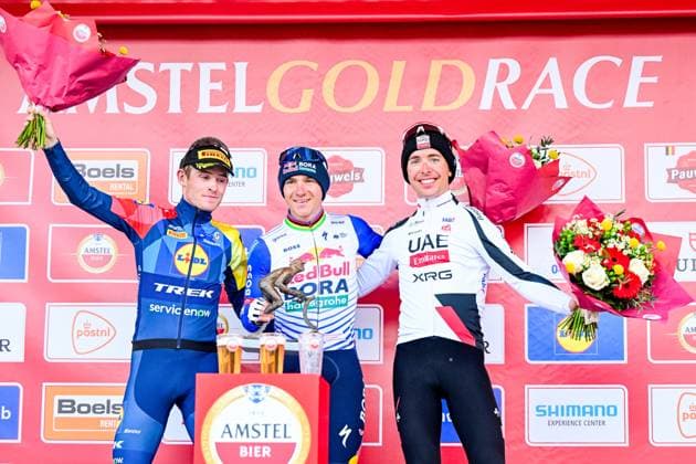 Danish Mattias Skjelmose of Lidl-Trek, Belgian Remco Evenepoel of Red Bull-BORA-hansgrohe and French Benoit Cosnefroy of UAE Team Emirates-XRG pictured on the podium after the men elite Amstel Gold Race one day cycling race, 257,4 km from Maastricht to Valkenburg, The Netherlands, Sunday 19 April 2026. DIRKxWAEM  x171345812x