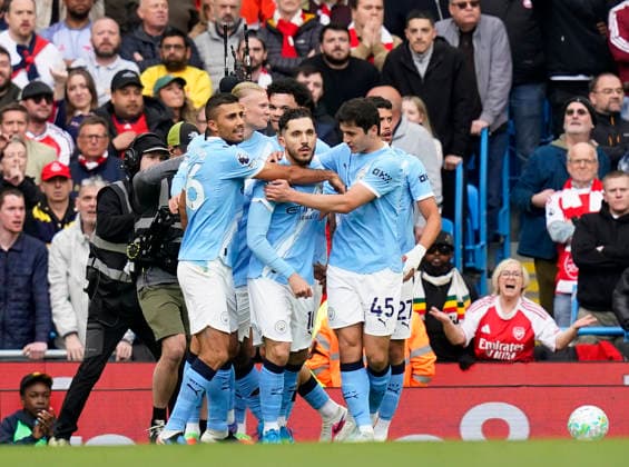 Manchester, England, 19th April 2026. Rayan Cherki of Manchester City celebrates scoring the first goal of the match during the Manchester City vs Arsenal Premier League match at the Etihad Stadium, Manchester. Picture credit should read: Andrew Yates Sportimage EDITORIAL USE ONLY. No use with unauthorised audio, video, data, fixture lists, club league logos or live services. Online in-match use limited to 120 images, no video emulation. No use in betting, games or single club league player publications. SPI_051_AY_Man_City_Arsenal SPI-4704-0050