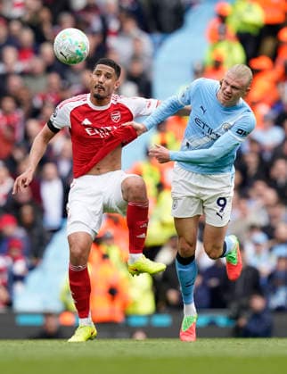 Manchester, England, 19th April 2026. William Saliba of Arsenal tussles with Erling Haaland of Manchester City during the Manchester City vs Arsenal Premier League match at the Etihad Stadium, Manchester. Picture credit should read: Andrew Yates Sportimage EDITORIAL USE ONLY. No use with unauthorised audio, video, data, fixture lists, club league logos or live services. Online in-match use limited to 120 images, no video emulation. No use in betting, games or single club league player publications. SPI_053_AY_Man_City_Arsenal SPI-4704-0052