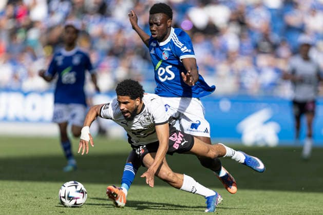 FOOTBALL : Racing de Strasbourg - Stade Rennes F. C - Ligue 1 - Stade de la Meinau - 19 04 2026 Cisse Amadou 45 Racing de Strasbourg et Mahdi Camara 45 Stade Rennes F. C  Copyright: xelyxandroxcegarrax