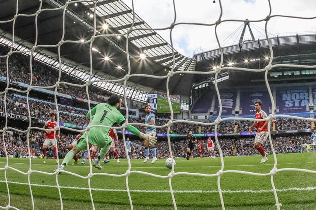 Premier League: Manchester City v Arsenal Rayan Cherki of Manchester City scores to make it 1-0 during the Premier League match Manchester City vs Arsenal at Etihad Stadium, Manchester, United Kingdom on 19 April 2026 (Photo by Mark Cosgrove News Images) Manchester Etihad Stadium Greater Manchester United, ManU Kingdom Copyright: xMarkxCosgrove NewsxImagesx