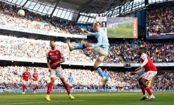 Manchester, England, 19th April 2026. Erling Haaland of Manchester City send a header over the bar during the Manchester City vs Arsenal Premier League match at the Etihad Stadium, Manchester. Picture credit should read: Andrew Yates Sportimage EDITORIAL USE ONLY. No use with unauthorised audio, video, data, fixture lists, club league logos or live services. Online in-match use limited to 120 images, no video emulation. No use in betting, games or single club league player publications. SPI_086_AY_Man_City_Arsenal SPI-4704-0085