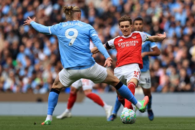 19th April 2026; Etihad Stadium, Manchester, Lancashire, England; Premier League Football, Manchester City versus Arsenal ; Erling Haaland of Manchester City competes for the ball with Martin Odegard of Arsenal DavidxBlunsden