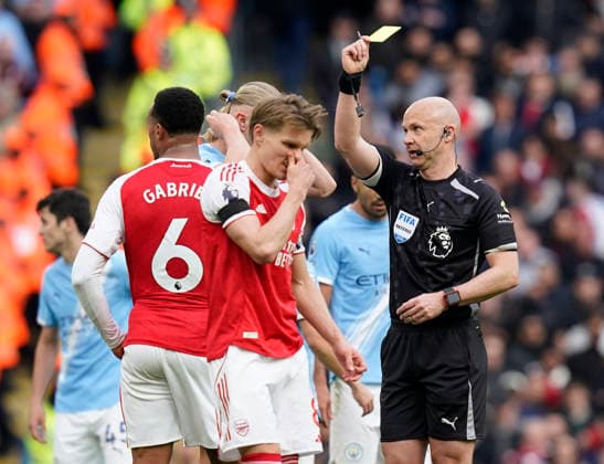 Manchester, England, 19th April 2026. Yellow cards for Gabriel of Arsenal and Erling Haaland of Manchester City following their clash during the Manchester City vs Arsenal Premier League match at the Etihad Stadium, Manchester. Picture credit should read: Andrew Yates Sportimage EDITORIAL USE ONLY. No use with unauthorised audio, video, data, fixture lists, club league logos or live services. Online in-match use limited to 120 images, no video emulation. No use in betting, games or single club league player publications. SPI_112_AY_Man_City_Arsenal SPI-4704-0109
