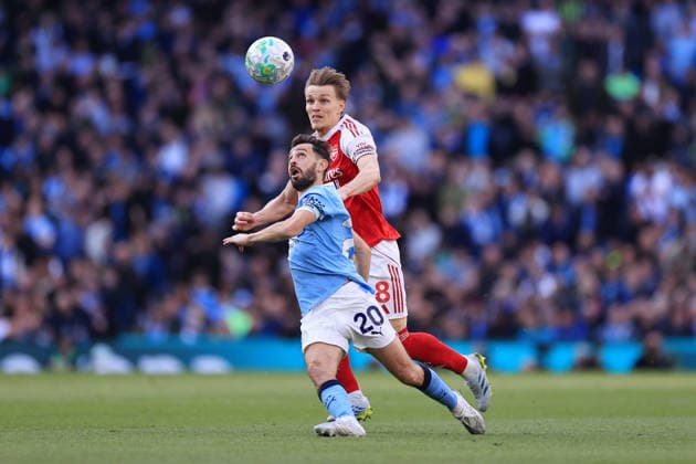Football - Premier League - Manchester City v Arsenal 19th April 2026 - Premier League - Manchester City v Arsenal - Bernardo Silva of Manchester City battles with Martin Odegaard of Arsenal - Photo: Simon Stacpoole Offside. Manchester UK Copyright: xSimonxStacpoolexOffside