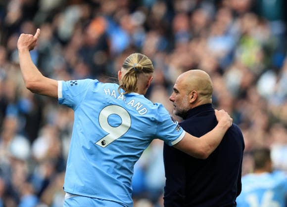 19th April 2026; Etihad Stadium, Manchester, Lancashire, England; Premier League Football, Manchester City versus Arsenal ; Erling Haaland of Manchester City celebrates with Manchester City manager Pep Guardiola at full time DavidxBlunsden