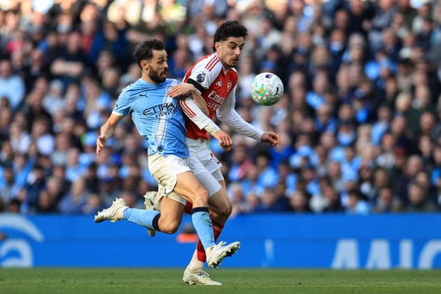 19th April 2026; Etihad Stadium, Manchester, Lancashire, England; Premier League Football, Manchester City versus Arsenal ; Bernardo Silva of Manchester City tackles Kai Havertz of Arsenal DavidxBlunsden