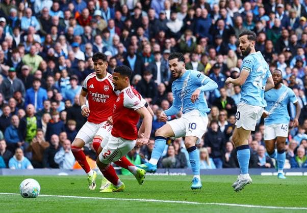 Rayan Cherki of Manchester City scores the opening goal Manchester City v Arsenal, Premier League, Football, Etihad Stadium, Manchester, UK - 19 Apr 2026Manchester Etihad Stadium United Kingdom EDITORIAL USE ONLY No use with unauthorised audio, video, data, fixture lists, club league logos or live services. Online in-match use limited to 120 images, no video emulation. No use in betting, games or single club league player publications. Copyright: xMattxWest Shutterstockx 16836204ac