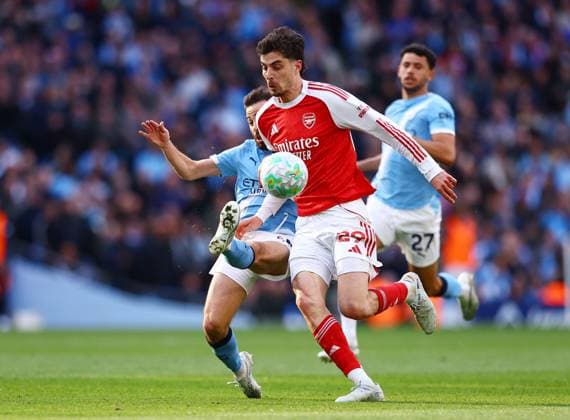 Bernardo Silva of Manchester City makes an important tackle on Kai Havertz of Arsenal Manchester City v Arsenal, Premier League, Football, Etihad Stadium, Manchester, UK - 19 Apr 2026Manchester Etihad Stadium United Kingdom EDITORIAL USE ONLY No use with unauthorised audio, video, data, fixture lists, club league logos or live services. Online in-match use limited to 120 images, no video emulation. No use in betting, games or single club league player publications. Copyright: xMattxWest Shutterstockx 16836204ap