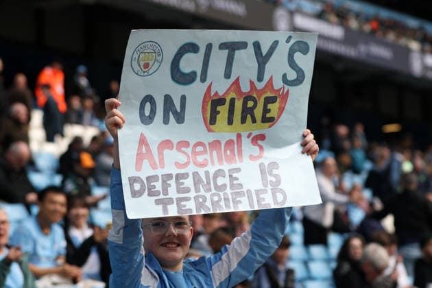 19th April 2026; Etihad Stadium, Manchester, Lancashire, England; Premier League Football, Manchester City versus Arsenal ; a young Manchester City fan hold up a placard DavidxBlunsden