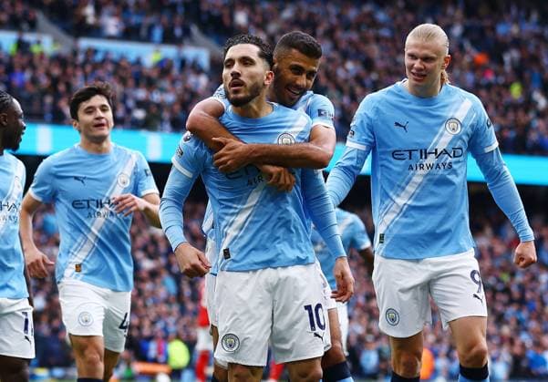 Rayan Cherki of Manchester City celebrates scoring the opening goal with their team-mates Manchester City v Arsenal, Premier League, Football, Etihad Stadium, Manchester, UK - 19 Apr 2026Manchester Etihad Stadium United Kingdom EDITORIAL USE ONLY No use with unauthorised audio, video, data, fixture lists, club league logos or live services. Online in-match use limited to 120 images, no video emulation. No use in betting, games or single club league player publications.  Copyright: xMattxWest Shutterstockx 16836204dh