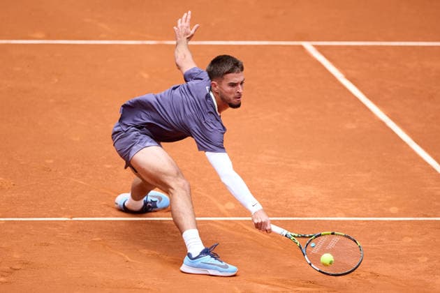 Mutua Madrid Open - Day One Dino Prizmic of Croatia plays a backhand against Christopher OÕConnell of Australia during the MenÕs Singles First Round Qualifying match on day one of the Mutua Madrid Open at Caja Magica on April 20, 2026, in Madrid, Spain. Madrid Caja Magica Madrid Spain RL_MMO2K26_000090 Copyright: xRicardoxLarreinax