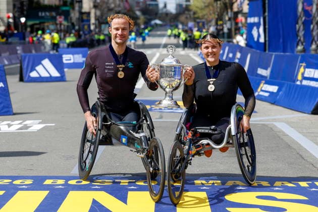 Boston Marathon Winners Marcel Hug of Switzerland (L) and Eden Rainbow-Cooper of Britain pose with the trophy after the 130th Boston Marathon in Boston, Massachusetts, USA, 20 April 2026. BOSTON MASSACHSETTS UNITED STATES  Copyright: xGREGxM.xCOOPERx