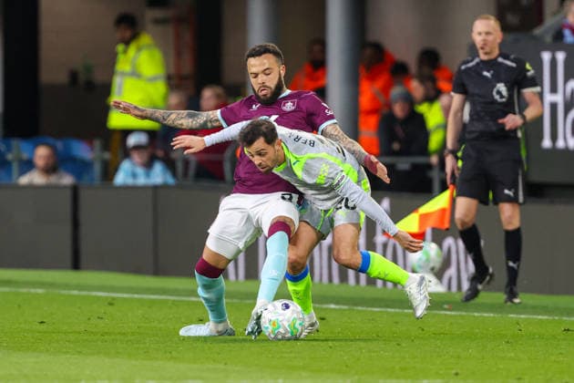 22nd April 2026; Turf Moor, Burnley, Lancashire, England; Premier League Football, Burnley versus Manchester City; Quilindschy Hartman of Burnley tackling Bernardo Silva of Manchester City AidanxHunter