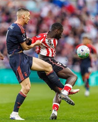 24th April 2026; Stadium of Light, Sunderland, England; Premier League Football, Sunderland versus Nottingham Forest; Nikola Milenkovic of Nottingham Forest battles with Brian Brobbey of Sunderland WMxSportsxMedia