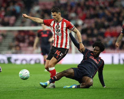 Sunderland, England, 24th April 2026. Granit Xhaka (L) of Sunderland in action with Ola Aina of Nottingham Forest during the Sunderland vs Nottingham Forest Premier League match at the Stadium Of Light, Sunderland. Picture credit should read: Nigel Roddis Sportimage EDITORIAL USE ONLY. No use with unauthorised audio, video, data, fixture lists, club league logos or live services. Online in-match use limited to 120 images, no video emulation. No use in betting, games or single club league player publications. SPI_030_NR_SUND_NOTT SPI-4720-0029