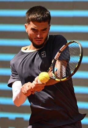 (260425) -- MADRID, April 25, 2026 -- Dino Prizmic hits a return during the men s singles round of 64 match between Dino Prizmic of Croatia and Ben Shelton of the United States at the 2026 Madrid Open tennis tournament in Madrid, Spain, on April 24, 2026. ) (SP)SPAIN-MADRID-TENNIS-MADRID OPEN-MEN S SINGLES ChengxMin 