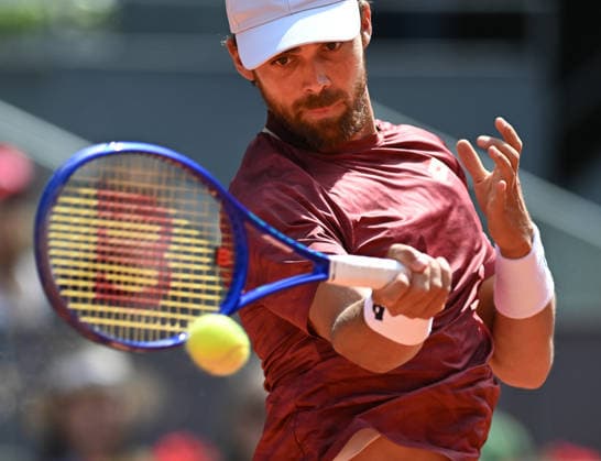 (260425) -- MADRID, April 25, 2026 -- Benjamin Bonzi of France hits a return during the men s singles round of 64 match between Jannik Sinner of Italy and Benjamin Bonzi of France in Madrid, Spain, on April 24, 2026. ) (SP)SPAIN-MADRID-TENNIS-MADRID OPEN-MEN S SINGLES ChengxMin 