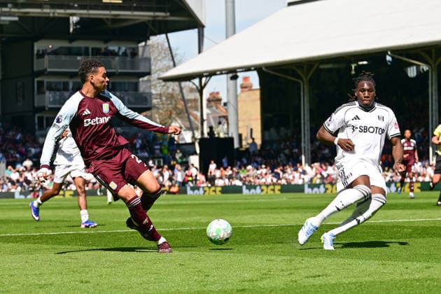 Fulham v Aston Villa, Premier League Aston Villa midfielder Morgan Rogers (27) looks to release the ball under pressure from Fulham defender Calvin Bassey (3) during the Premier League match between Fulham and Aston Villa at Craven Cottage, London, UK on 25 April 2026. London Craven Cottage Greater London UK Editorial use only DataCo restrictions apply See www.football-dataco.com , Copyright: xDennisxGoodwinx PSI-24149-0047