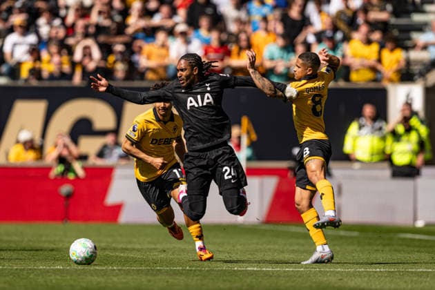 25th April 2026; Molineux Stadium, Wolverhampton, West Midlands, England; Premier League Football, Wolverhampton Wanderers versus Tottenham Hotspur; Djed Spence of Tottenham Hotspur is fouled by Joao Gomes of Wolverhampton Wanderers GodfreyxPitt